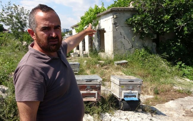KAMERA ŞÜPHELİNİN FOTOĞRAFINI ÇEKTİ: ARILIĞA GİREN ŞAHIS, KAMERAYA ZARAR VERDİ